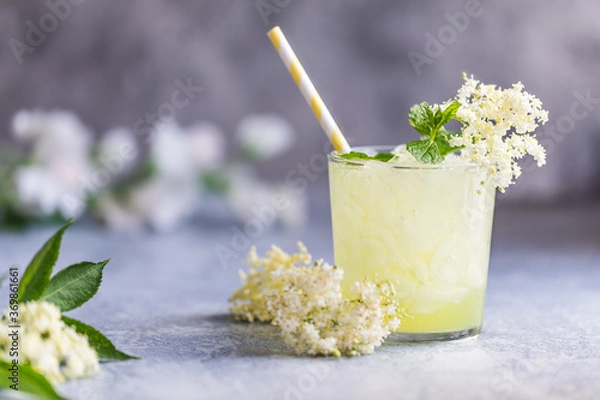 Obraz Lemonade with lemon lime and elderberry flowers