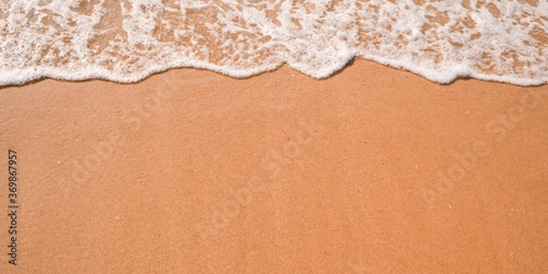 Fototapeta Tourist travel banner design template, copy space. White foam of a sea wave, golden sand beach, turquoise ocean water.