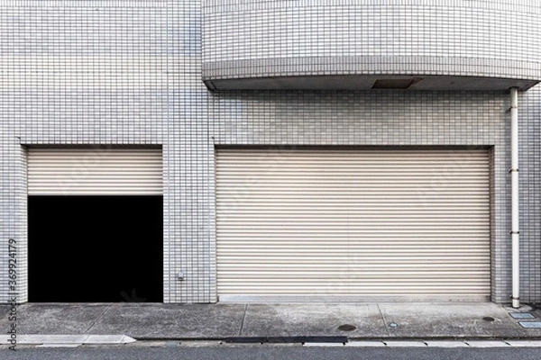 Fototapeta Garage at the building that opens the door.
