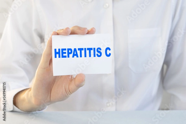 Obraz Doctor holding a card with text HEPATITIS C, medical concept
