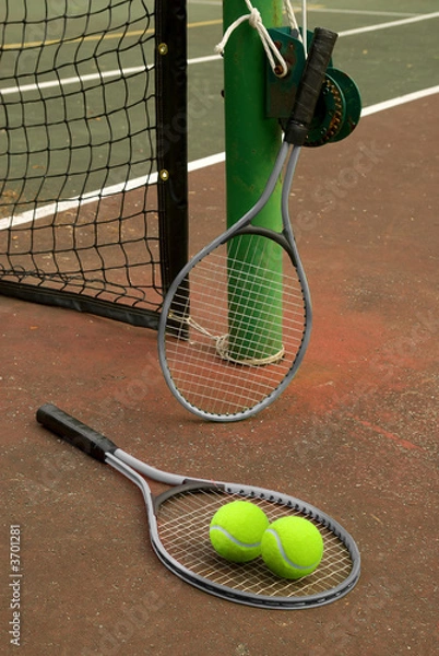 Obraz Tennis court with balls and rackets in front of net