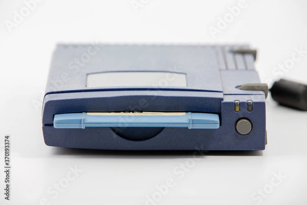 Fototapeta zip drive with blue disk inserted over white background