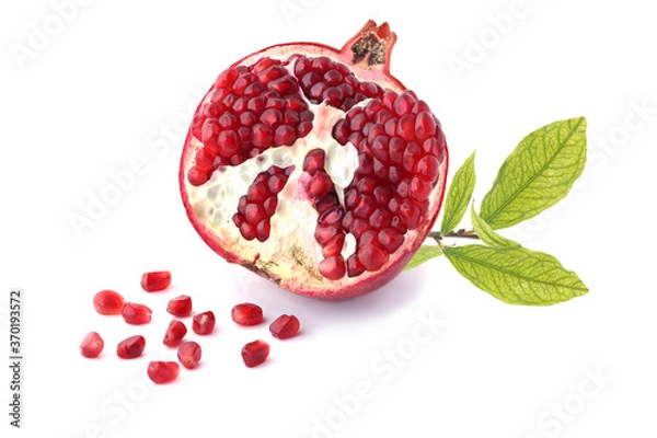 Fototapeta Half of pomegranate with twig isolated on white