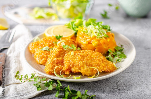 Fototapeta Crispy schnitzel with cornflakes