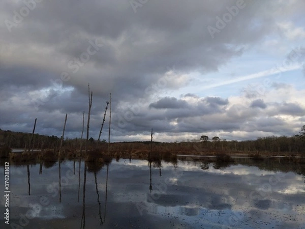 Fototapeta clouds over the lake