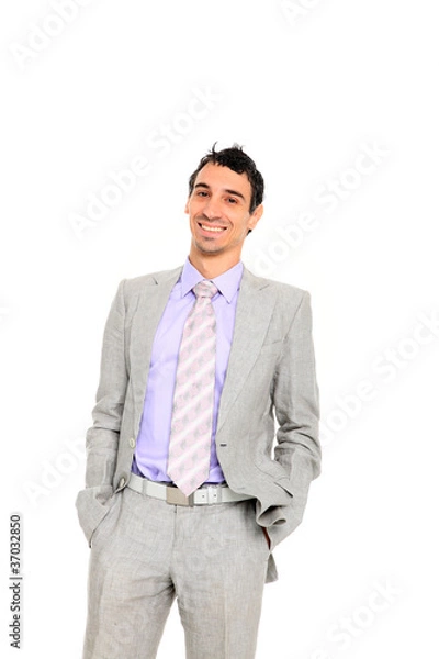 Fototapeta young business man standing with hands in pocket