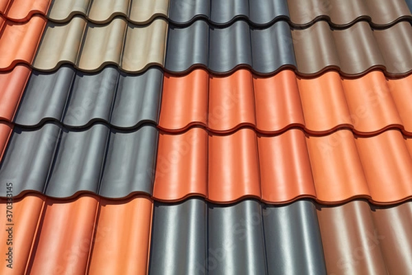 Obraz Ein Dach ist mit verschieden farbigen Dachpfannen gedeckt.