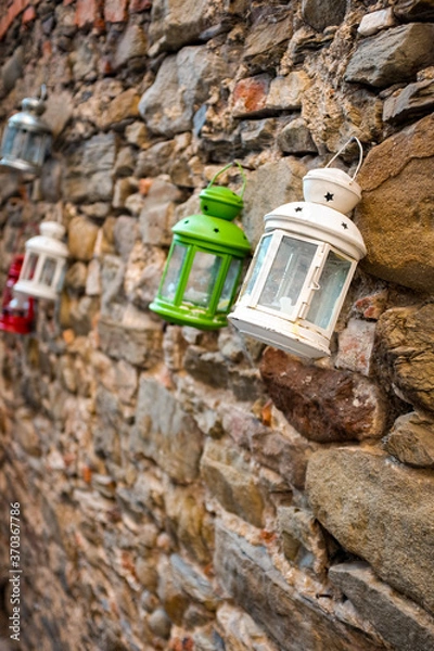 Obraz Lanterns on a stone wall