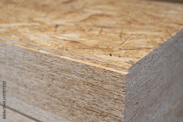 Fototapeta OSB sheets are stacked in a hardware store. Building material wood