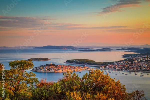 Fototapeta Panoramic view of Adriatic coast with The Primosten town at the colorful dawn of the day, Croatia, Europe.