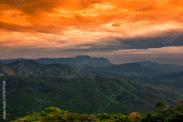 Fototapeta Natural background, high angle from the high mountains that can see the scenery around, the wind blows through the cool, blurred of traveling, the integrity of the moist forest.