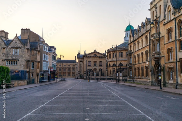 Obraz Broad Street in Oxford with no people or vehicles. The Clarendon Building and The Sheldonian Theatre in the background. Early in the morning. Oxford, England, UK.