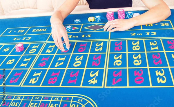 Fototapeta Casino player doing a bet