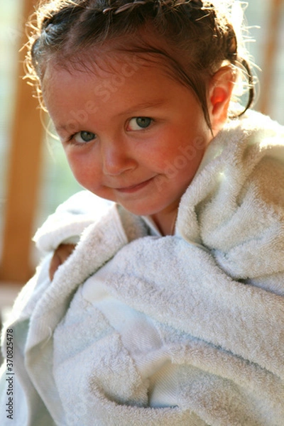 Obraz portrait of a little girl wrapped in a towel