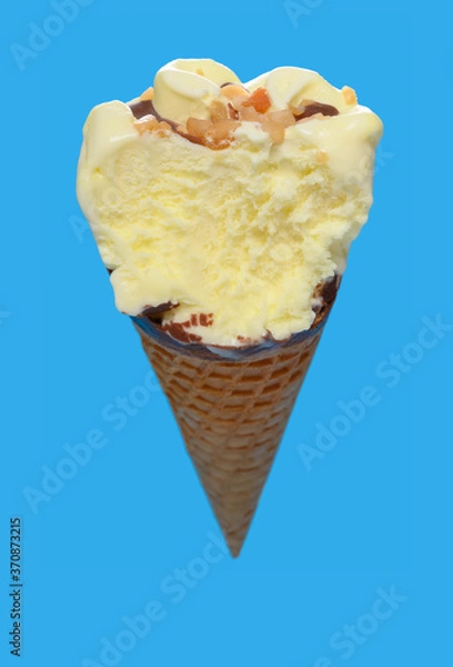 Fototapeta angle view vanilla flaovr ice cream cone with a big bite on a blue background