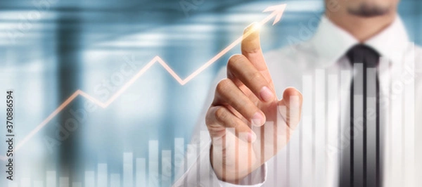Fototapeta Businessman plan graph growth increase of chart positive indicators in his business
