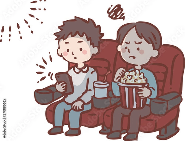 Fototapeta 映画上映中にスマートフォンを見る男性