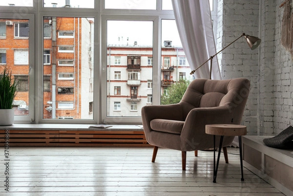 Fototapeta  armchair in a bright room with a window background