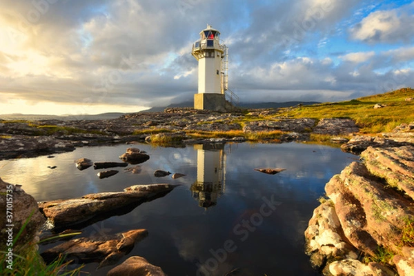 Obraz View of Rhue Lighthouse at sunset near Ullapool, North west scotland.