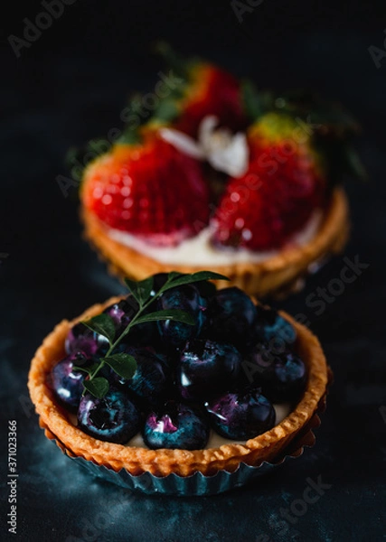 Obraz blueberry cheesecake on dark background.