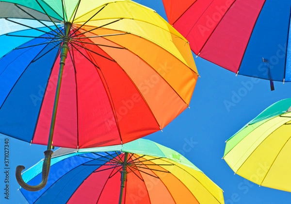 Fototapeta Beautiful view of colorful umbrellas against the blue sky