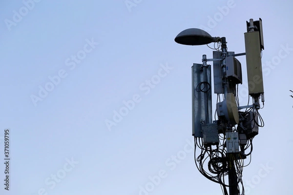 Fototapeta 3G, 4G, 5G telecommunication voice and data antennas are seen in a street light pole of the city of Istanbul, Turkey.