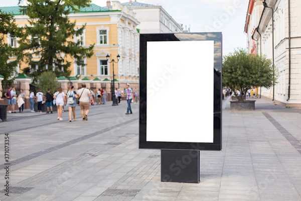Fototapeta Outdoor mock up of a blank information poster; an empty vertical street banner template; billboard placeholder mockup on a city  alleyway outdoors with people