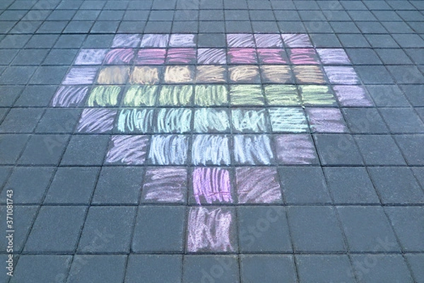 Obraz Children's drawing a heart with colored chalks on the paving tiles. Peace, kindness and love concept.