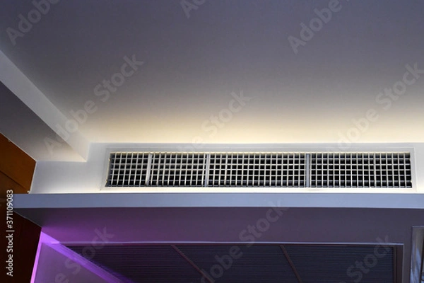 Fototapeta built in ceiling unit of FCU and return air grill, VRV VRF multi-split type air conditioner system in hotel room, Concept image for HVAC system or temperature .