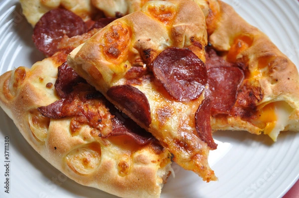 Obraz image of pizza sliced on the plate