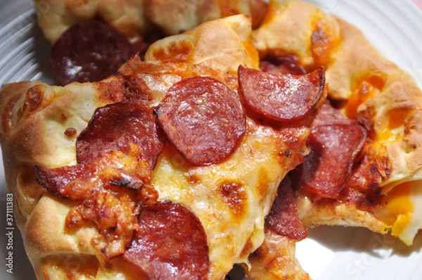Obraz image of pizza sliced on the plate
