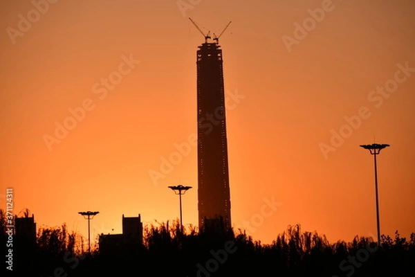 Obraz Silhouette of the highest skyscraper in Tianjin, China in sunset light
