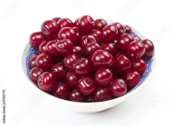 Fototapeta Bowl with ripe cherries. Isolated on a white background.