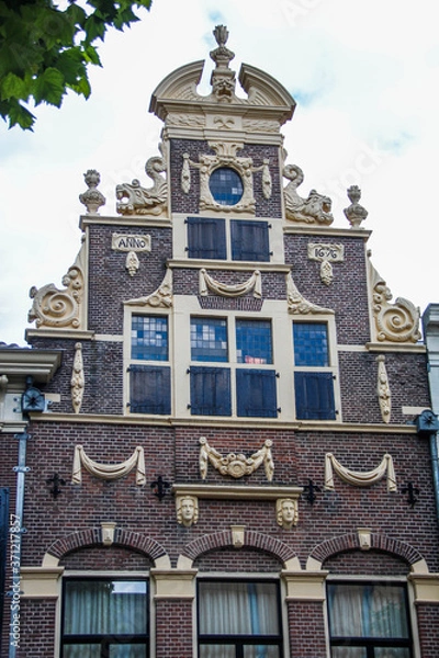 Obraz Deventer, Netherlands - July 11 2020: Ancient Facade of an old "Golden Age" style house in the center of town.