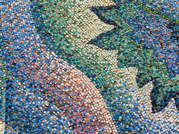 Fototapeta Detail of beautiful old collapsing abstract ceramic mosaic adorned building. Venetian mosaic as decorative background. Selective focus. Abstract Pattern. Abstract mosaic colored ceramic stones
