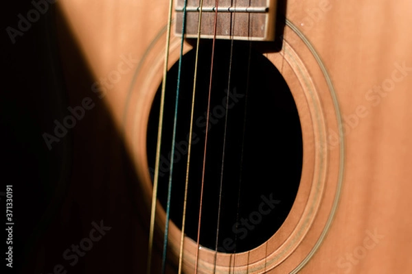 Fototapeta Close-up guitar with half sun highlight and shadow