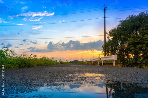 Obraz 夕焼けと水たまり