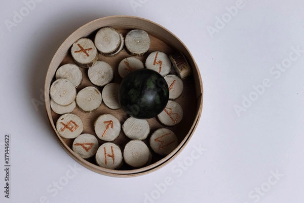 Fototapeta Scandinavic runes in the round box