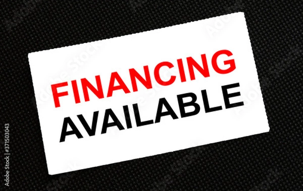 Fototapeta White card on the black background with text Financing Available