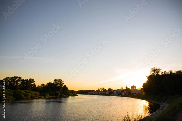 Fototapeta sunset over the river