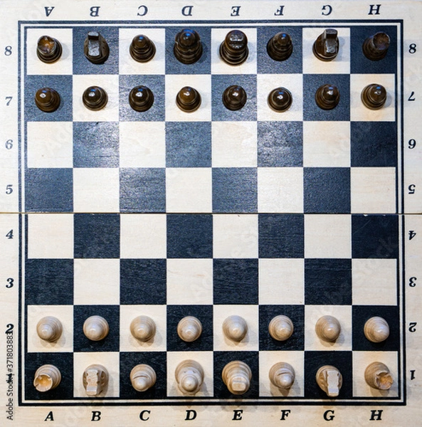 Fototapeta black and white chessboard with chessmen (game)