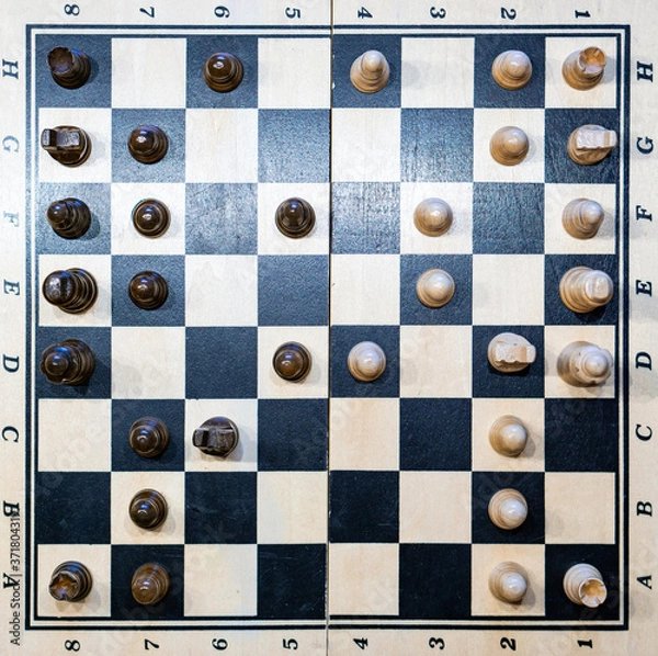 Fototapeta black and white chessboard with chessmen (game)