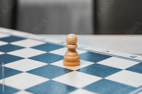 Fototapeta chessman pawn on a chessboard