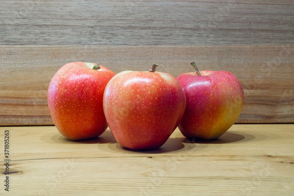 Fototapeta red apples on wooden table