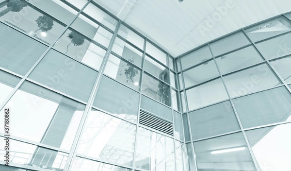 Fototapeta wide glass surface of contemporary angle of business building