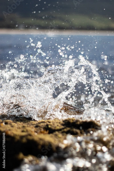 Obraz wave hitting a rock