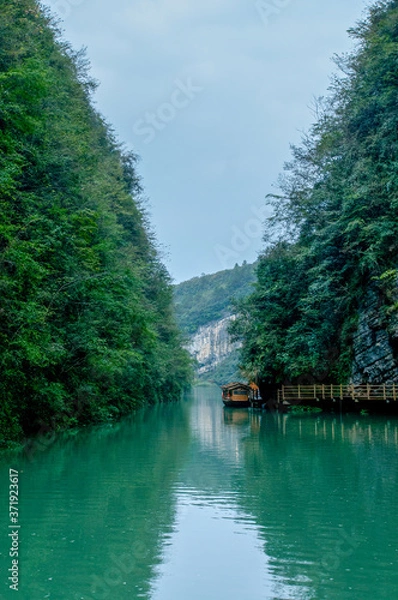 Obraz Zhangjiajie Grand Canyon, Hunan, contains mountain streams, silk-like smooth water, birds playing in the water, aquatic plants, ossy stones, cliffs, green trees environment, blue sky and reflection as
