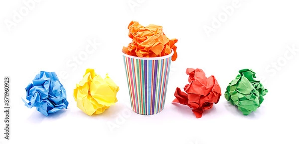 Fototapeta Colored wrinkled paper and paper cup, close up on white background