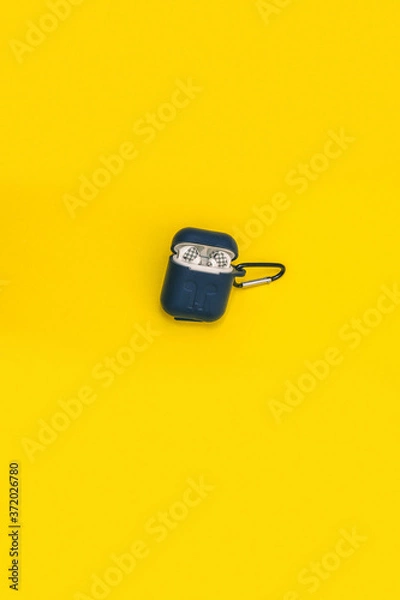 Obraz Wireless Earphones on a Yellow background