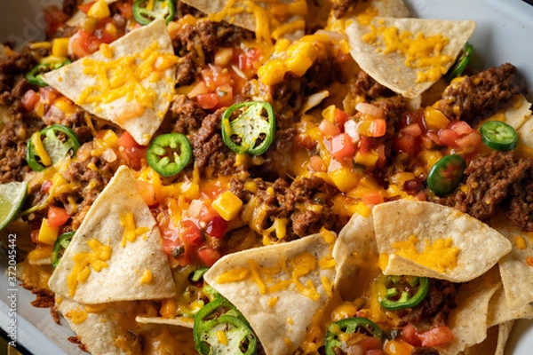 Obraz nachos in white iron pan